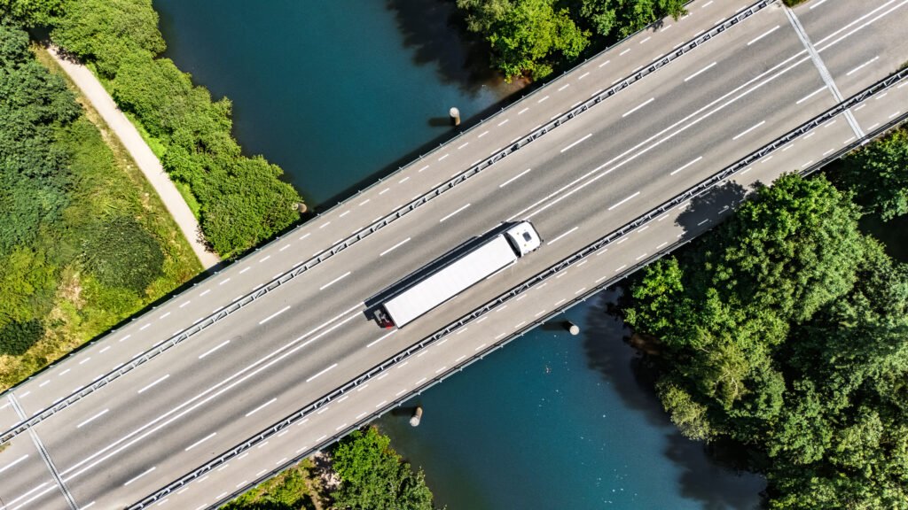 bridge over canal with truck aerial drone view, dutch landscape, transportation concept, the netherlands